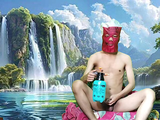 Masturbating with a dildo made from a bottle, used under a waterfall.