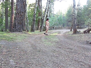 Naked walk on a dirt road.