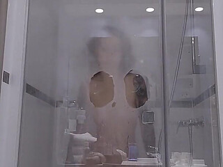 A Slut Dildos Herself During Her Shower, Comes to Watch on Her Through the Transparent Glass Window