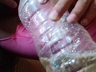 Pissing in bottle and collecting lot of piss in bottle