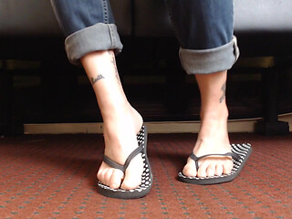 Dotted flipflop shoe play closeup
