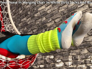 Mistress foot teasing you in hanging chair in white dirty socks and blue tights