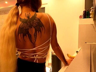 Hot tattooed blonde long hair beauty in the kitchen takes her panties off to show her meaty pussy an