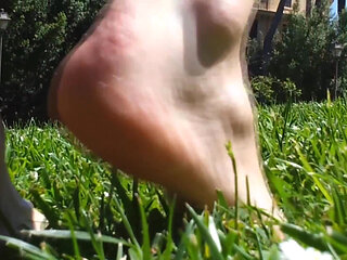 Nyllady Walking Barefoot on Th Grass in a Park