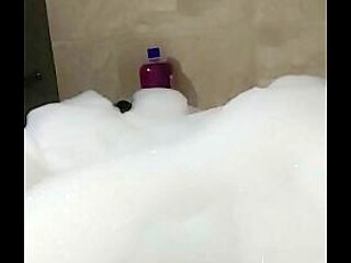 Male cosplayer enjoys a relaxing bubble bath solo