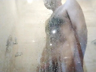 He's naked at the shower. I get so horny watching him while he's naked.