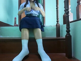 High school student fake on the stairs of a Real Thai Solo house