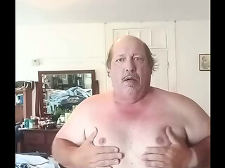 In girls dress playing with tits