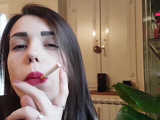 Smoking in close up with a beautiful girl