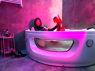 Mistress' Taking a Bath in Latex and Boots