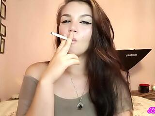 XO Bunny brunette latina with blue eyes smoking blowing smokein your face