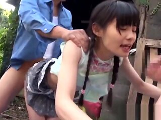A beautiful girl is outdoors being fingered by two men and gets bukkake'd.