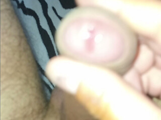 A beautiful excited penis, naked, with a large beautiful head, flows profusely with pleasure