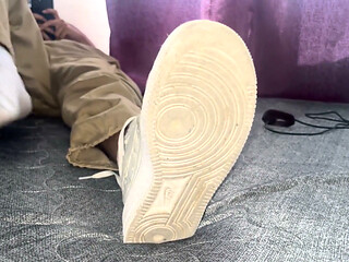 A University Rests Her Feet on Her Face so That the Adorers