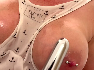 Oiled my BigTits and Pierced Nipples and Masturbates with Silver Vibrator