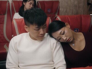 Asian MILF with big tits gives a blowjob in a public bus