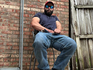 Booted Bearded Fella Cigar and Edge Out Back