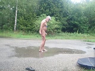 Exhibited naked in the rain with nipple work on the clamps