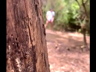 Boy caught peeing in the woods