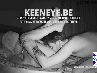 A couple is seen during a private moment on the bed