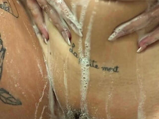 short hair tattooed girl tke a shower and masturbate