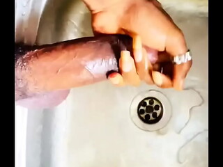 Washing my BBC in the kitchen sink before washing the plates. FULL CUM VIDEO IN RED. Who wants my Dick?