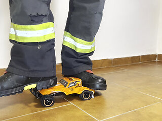Firefighter stomping RC Car with Haix