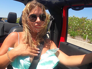 Busty Blonde MILF Gives Road Head While Driving