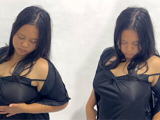 Beautiful girl with big breasts and perfect body is having fun playing with her boobs