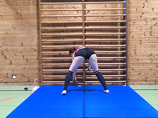 Gym nymph toys herself with a toy in the open gym