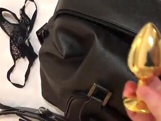 BDSM master is unpacking toys for pleasuring BDSM fetish porn