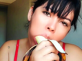 Young girl training blowjob on banana, deep throat