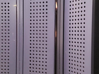 oiled, masturbating in a gym locker room