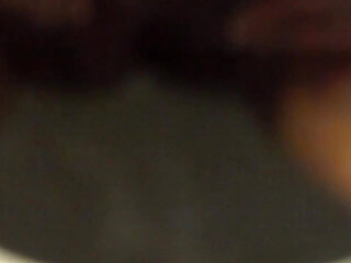 Closeup of Jen peeing into the toilet