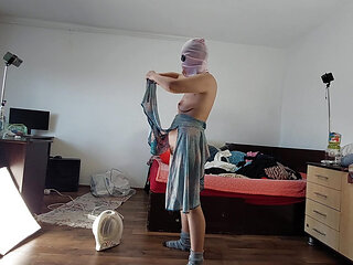 Sexy mom has fun trying on clothes and cutting them. Brunette hairy pussy, big tits.