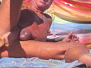 Key West oiled up using his new larger dildo at the beach