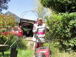 In outfit with a genital cover to mow the lawn.