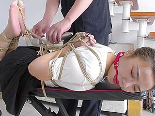 Slender Asian Girl With Sexy Legs Is Introduced To Bondage