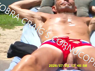 7-22-2026 COCK SHOT TANNING WITH TUNES ROD STEWARTS IN FACES 1.mp4