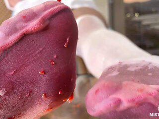 My Nylon Feet Squeezing Strawberry Juice on a Glass Table