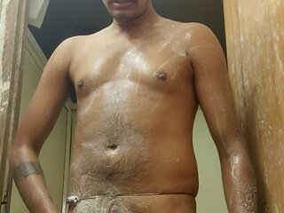 India boy cold water nude shower