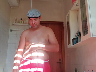 Nude boy in bathroom