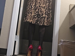 Red high heels and leopard dress