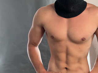 Young bodybuilder posing in a tight jock