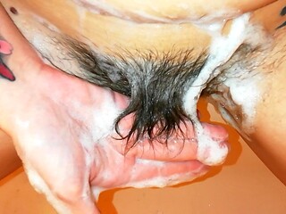 Petite and hairy GF showers and shows off her hairy cunt
