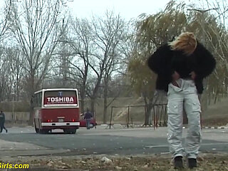 Young girl pissing on street