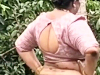 A Full-figured Woman in a White Skirt and Pink Top Strips Down and Walks Nude Outside