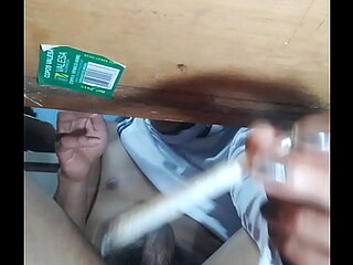 Sexy tattooed black guy jacks it under the table