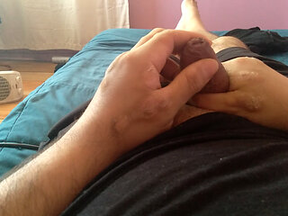 Gay man masturbates his large penis with great passion.