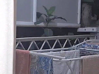 Naughty Housewife Showing off to Passers-by While Her Husband Works